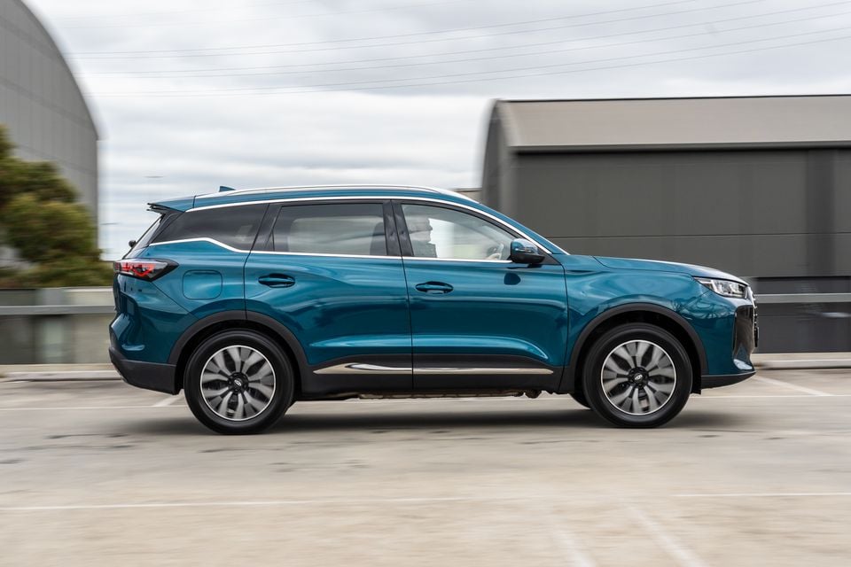 A teal 2026 Chery Tiggo 7 Super Hybrid SUV seen from the side in a car park