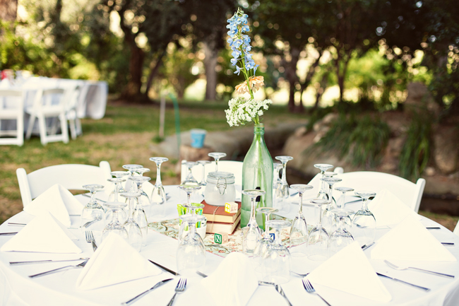 Reception table with a single-stem bottle bud vase