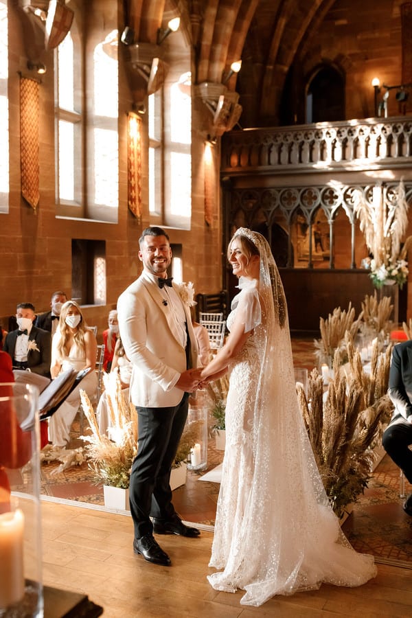 Bride in a Berta gown at a Christmas castle micro-wedding