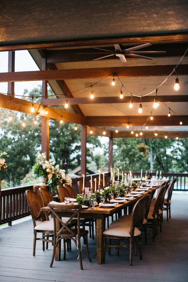 Single long wooden table set for an intimate family-only wedding dinner
