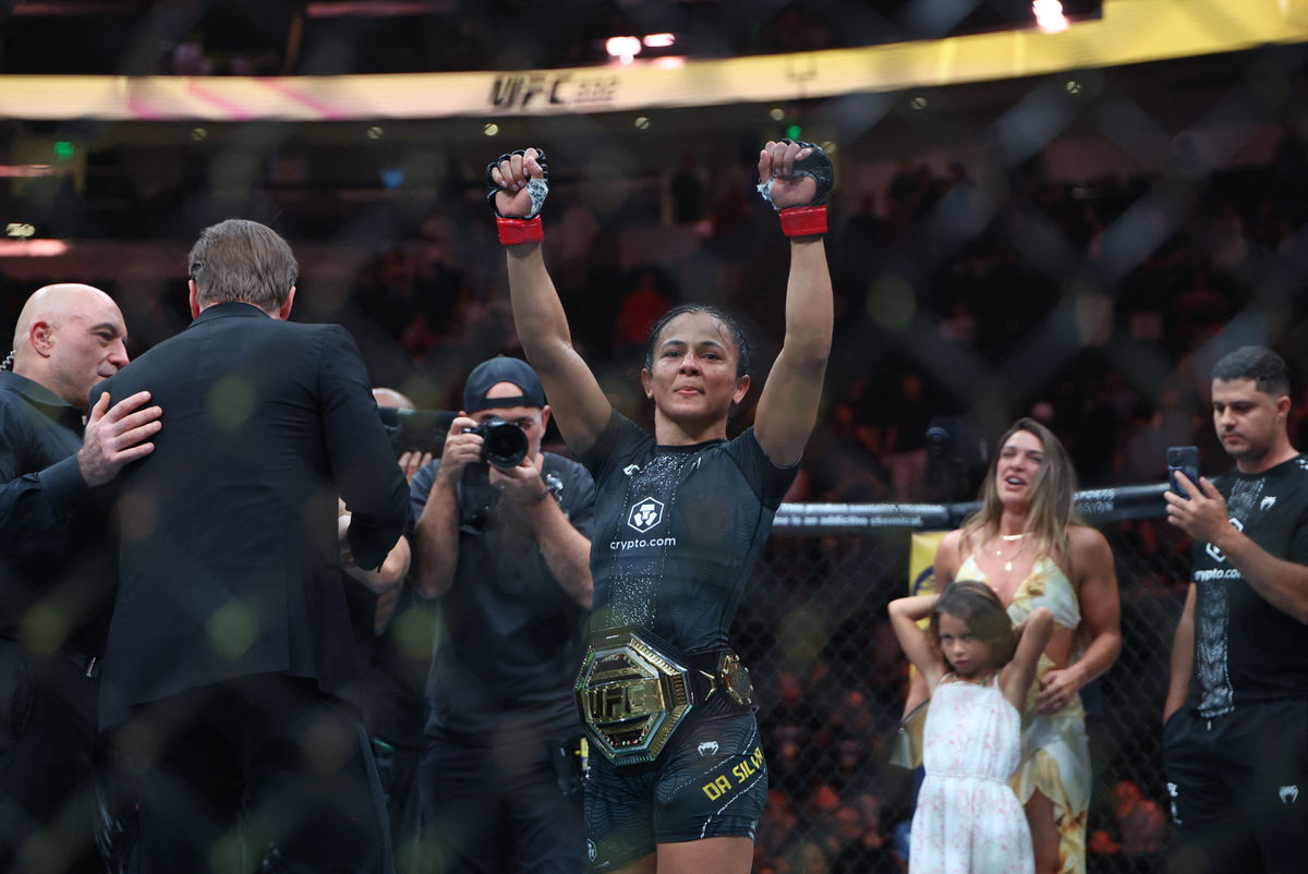 Oct 3, 2026; Salt Lake City, Utah, USA; Natalia Silva (red gloves) celebrates after the fight against Wang Cong (blue gloves) during UFC 332 at Delta Center. Mandatory Credit: Rob Gray-Imagn Images