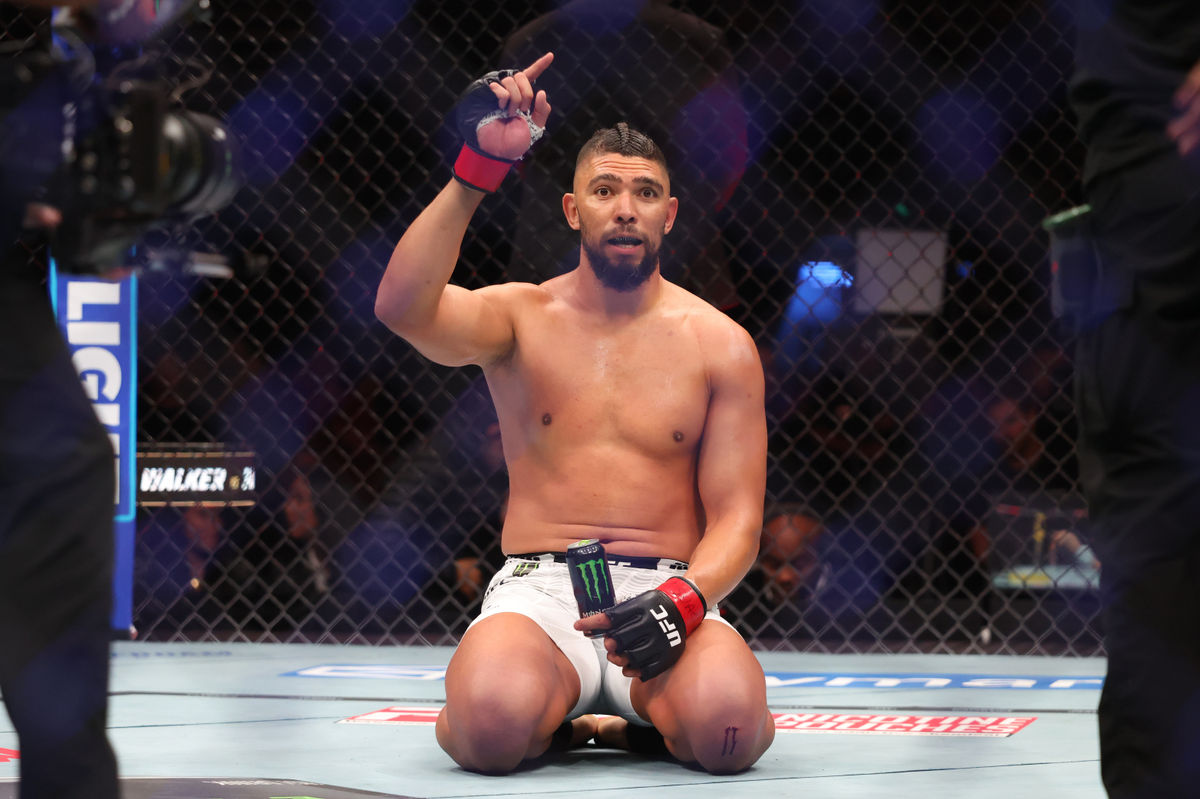 Oct 3, 2026; Salt Lake City, Utah, USA; Johnny Walker (red gloves) reacts after the fight against Mick Parkin (blue gloves) during UFC 332 at Delta Center. Mandatory Credit: Rob Gray-Imagn Images