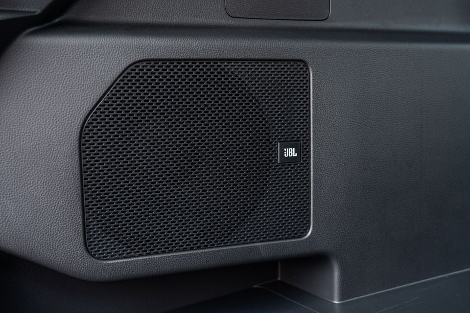 A close-up of a JBL branded speaker set into the dashboard of a 2026 Toyota RAV4 Cruiser