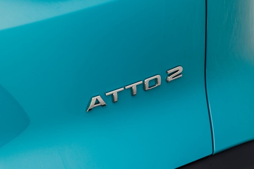 Close-up of the "Atto 2" badge on the rear of a teal BYD Atto 2