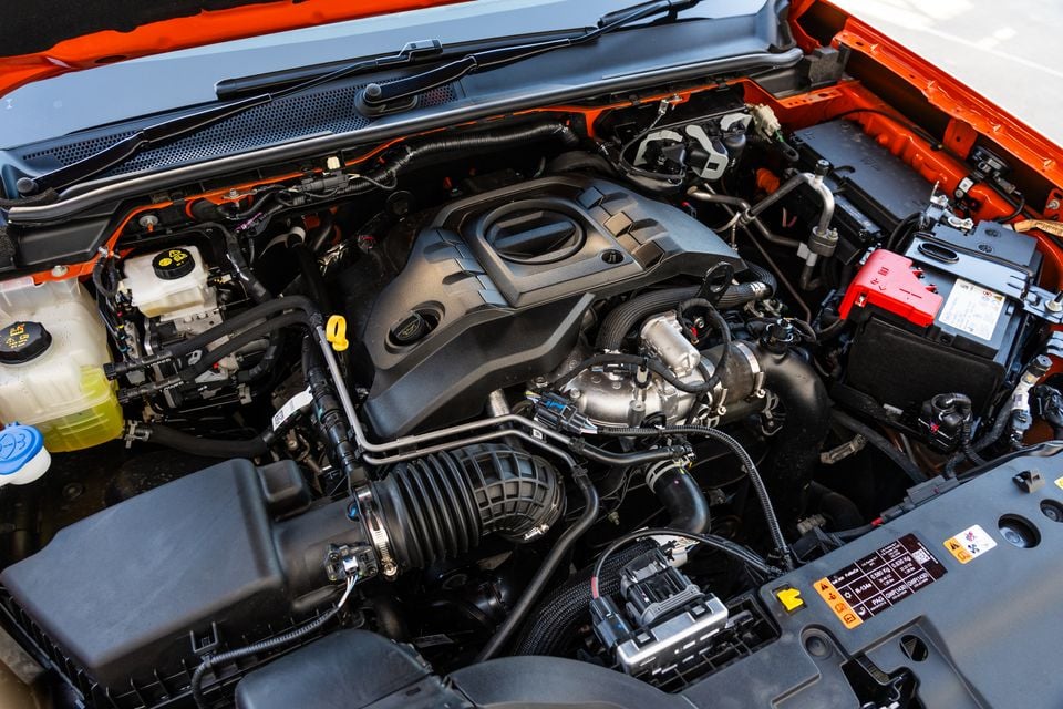 Engine bay of a 2027 Ford Ranger Wildtrak showing the turbocharged petrol engine with bonnet open