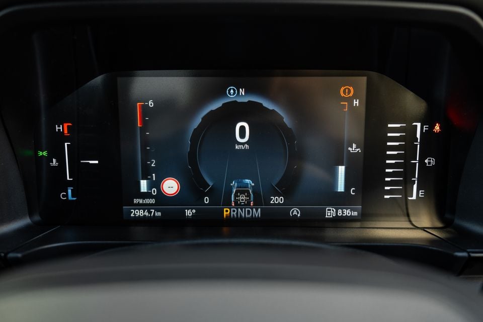 Digital instrument cluster of a Ford Ranger Wildtrak showing 0 km/h speedometer, gear selector in Park, odometer reading 2984.7 km, and a lane graphic on screen