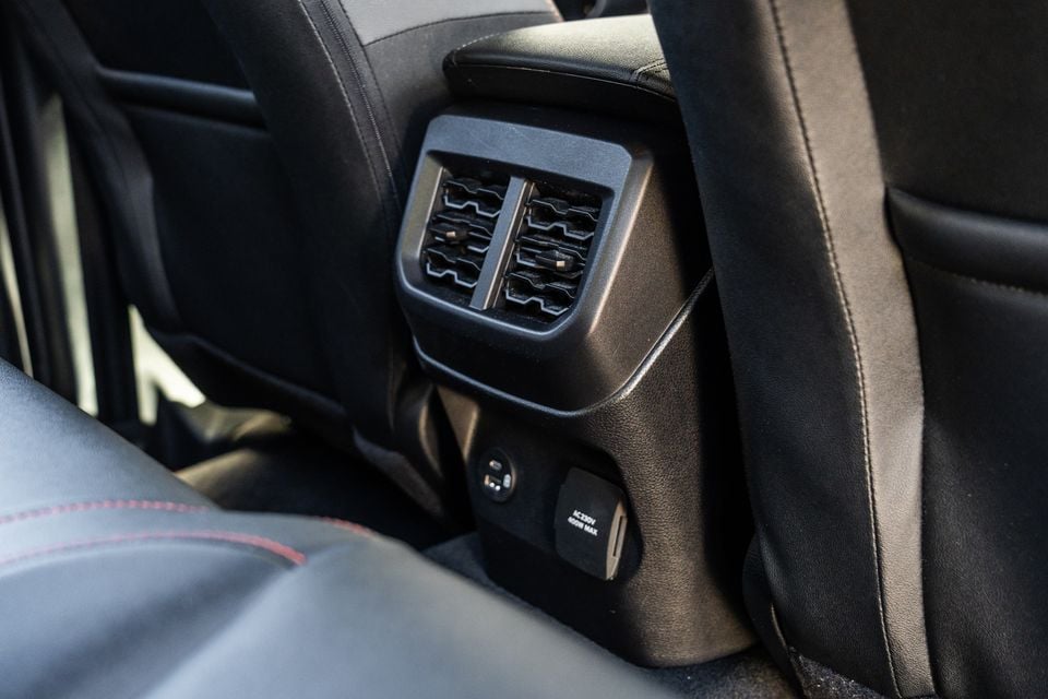Rear air vents, USB-C port and AC 250V power outlet on the rear console of a Ford Ranger Wildtrak