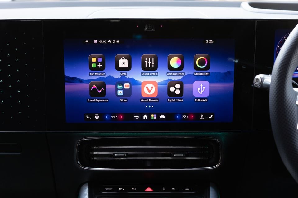 Central touchscreen in the 2027 Mercedes-Benz GLB 350 4Matic electric showing the app menu above the air vent and climate controls