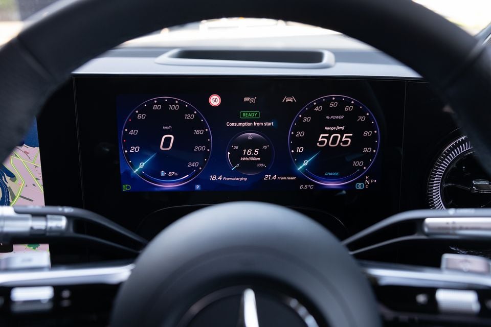 Digital instrument cluster in the 2027 Mercedes-Benz GLB 350 4Matic electric showing 505km of range, seen through the steering wheel