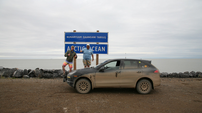 Alex and I with the Porsche Cayenne Diesel at the Arctic Ocean in Tuktoyaktuk, NWT