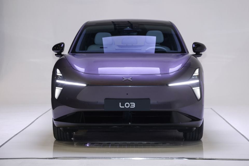 A purple 2026 XPeng L03 SUV shown head-on in a studio setting.